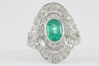 An 18ct white gold Art Deco style emerald and diamond cluster ring 