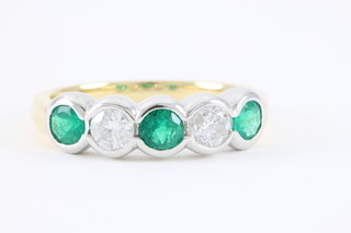 An 18ct white and yellow gold 5 stone emerald and diamond half hoop eternity ring, emeralds approx 0.50ct, diamonds approx 0.47ct