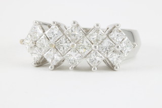 An 18ct white gold 16 stone Princess cut diamond dress ring, approx 2ct
