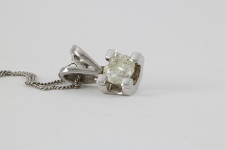 An 18ct white gold single stone diamond pendant, approx 0.24ct on a 9ct white gold chain