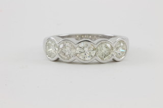 An 18ct white gold five stone diamond half hoop ring, approx 1.78ct