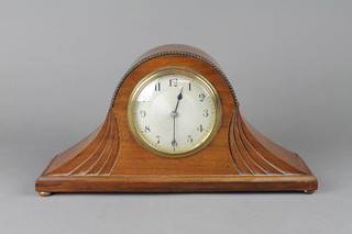A 1930's bedroom timepiece with silvered dial and Arabic numerals contained in a mahogany Admiral's hat shaped case 12"