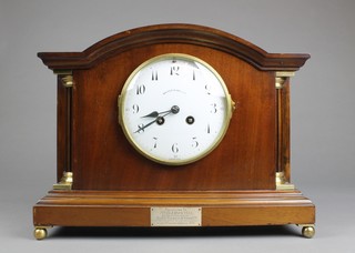 Japy Freres, an 8 day striking mantel clock with enamelled dial and Arabic numerals contained in a mahogany arch shaped case by Walker & Hall 