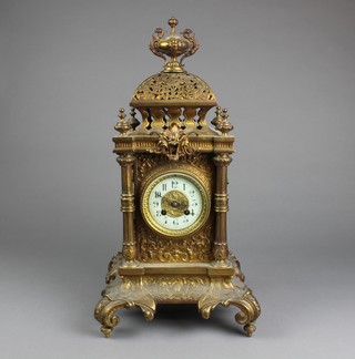A late 19th Century German gilt brass tower clock, with foliate pierced decoration having Arabic enamelled dial set 8 day cylinder movement chiming gong, 20.5"h x 11"w x 10.5"d 