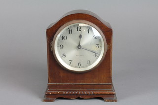 An early 20th Century bulle electric clock, housed within a  walnut case and set Arabic silvered dial, 8.5"h x 7"w x 5"d