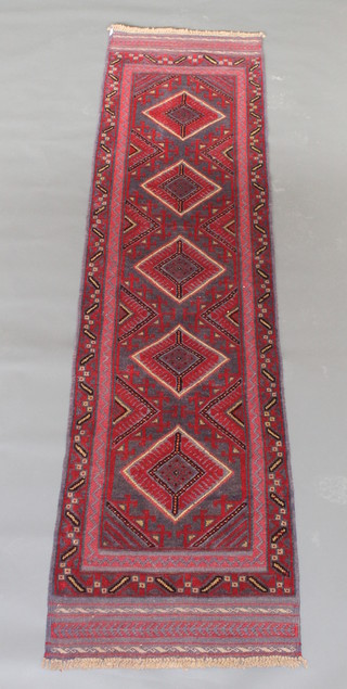 A red and blue ground Meshwani runner with 5 octagons to the centre 104" x 25 1/2"