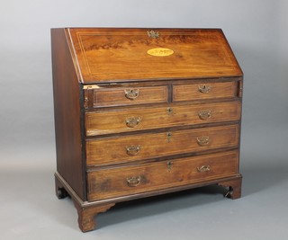 A George III inlaid mahogany bureau, the conch shell inlaid fall front revealing a well fitted architectural interior with 3 secret compartments above 2 short and 3 long graduated drawers, raised on bracket feet 44"h x 42"w x 22 1/2"d 