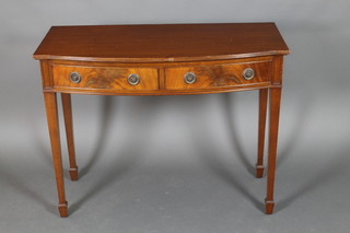 A Georgian style mahogany bow front side table fitted 2 drawers, raised on square tapering supports ending in spade feet 32 1/2" x 42 1/2" x 19 1/2"