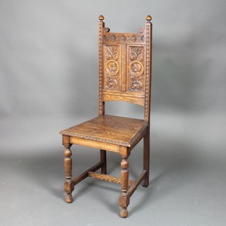 A Victorian carved oak hall chair with solid seat, the back carved classical figures, raised on turned and block supports