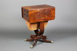 A Regency flame mahogany Pembroke work table with 2 real and 2 dummy drawers and sewing drawer, raised on a quatrefoil base with scroll legs and brass claw caps, 28"h x 20"w x 13"d when closed and 30"d when open 
