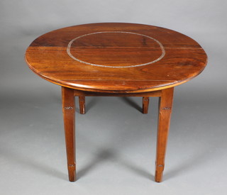 An Indian carved hardwood dining suite comprising oval extending dining table with 1 extra leaf  30"h x 49"w x 51"l closed, 71"l when extended, raised on square tapering legs, together with 4 high back open arm chairs, the table 