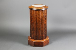 A Victorian cylindrical mahogany wash stand the hinged lid fitted a marble panel and revealing a blue wash bowl 30"h x 15 1/2"diam