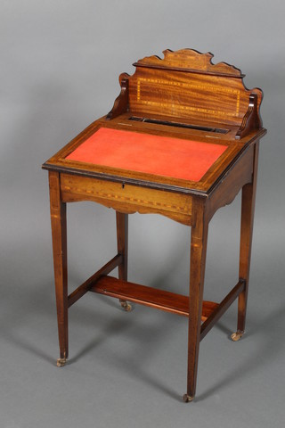 An Edwardian inlaid mahogany Davenport with inset red writing surface, the raised back fitted a pen recess and 2 inkwell recesses, the interior fitted pigeon holes raised on square tapered supports united by an H framed stretcher 39"h x 21"w x 19"d 