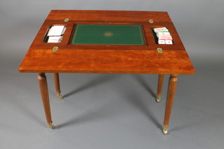 A Franklyn Mint limited edition House of Faberge Imperial mahogany games table, the interior fitted a Backgammon Board, chess/draughts board and various cards, the 2 drawers fitted a cribbage board, dominoes, a gilt metal chess set and a 12 piece draughts set  30"h x 38 1/2"w x 39"d 