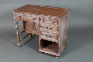 Garnett & Sons, a Victorian limed oak kneehole pedestal desk with brown leather writing surface, the back fitted an inkwell and pen receptacle, the side fitted a cupboard enclosed by panelled doors and fitted 1 long and 3 long drawers above a recess, marked and stamped 9830, raised on turned and block supports, with label to drawer "Designed and manufactured by R Garnett & Sons of Warrington" 30"h x 36"w x 21"d, 