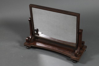 A William IV rectangular dressing table mirror contained in a mahogany swing frame 23"h x 27 1/2"w x 11"d (some sections of beading missing to edge)