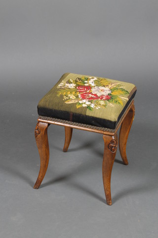 A Victorian square carved walnut stool raised on cabriole supports with Berlin woolwork seat 16"h x 13"w x 14"d