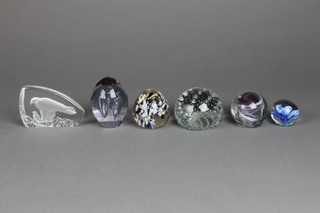 A collection of 6 modern glass paperweights