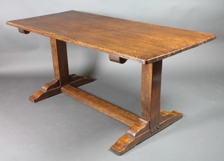 An elm refectory dining table, raised on square supports united by an H framed stretcher 29 1/2"h x 66"w x 30"d 