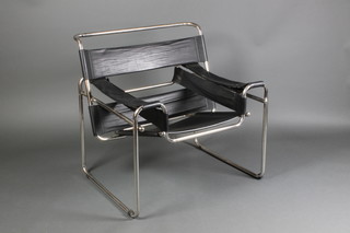 A tubular metal framed open arm chair with leather panels