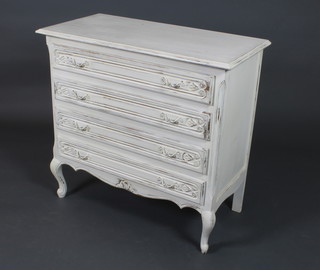 A french white painted chest of 4 long carved drawers, raised on cabriole supports 34"h x 35"w x 17 1/2"d 