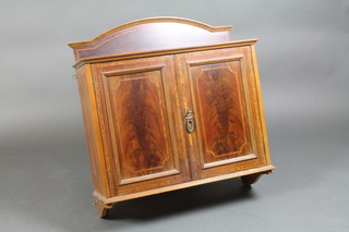 An Edwardian inlaid mahogany hanging cabinet with raised arched back enclosed by panelled doors 28 1/2"h x 28"w x 10"d 