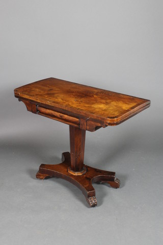 A William IV D shaped card table with crossbanded top, raised on a chamfered tapering column and triform base with scroll feet 28"h x 35"w x 17"d 
