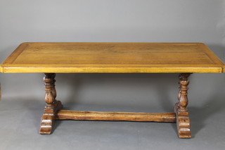 A 17th Century style elm refectory dining table raised on 4 turned supports with H  framed stretcher 28 1/2"h x 80"w x 39"w 