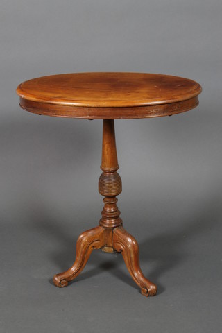 A 19th Century oval Continental bleached mahogany wine table raised on a turned column and tripod base (base f and r) 28"h x 24"w x 16"d 