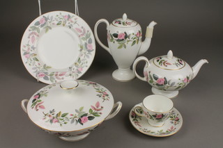 A Wedgwood Hathaway rose pattern tea, coffee and dinner service comprising teapot, coffee pot, tureen and lid, sugar bowl, milk jug, gravy boat and stand, 9 coffee cups, 6 saucers, 7 tea cups, 6 saucers, 8 large plates, 8 small plates, 4 small plates and 4 dessert bowls