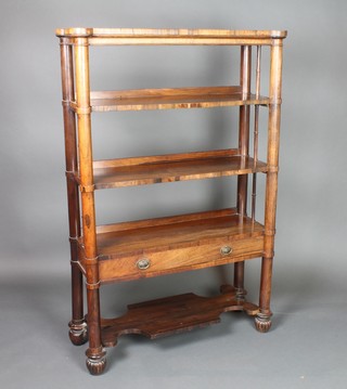 A Regency rectangular rosewood 5 tier what-not, fitted a drawer and raised on turned, reeded and bun supports 48 1/2"h x 31"w x 11 1/2"d 
