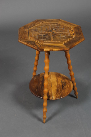 An octagonal inlaid olive wood occasional table, the top inlaid a Jerusalem cross and marked Jerusalem, having a circular undertier and raised on bobbin turned supports 22"h x 15"w x 14 1/2"d 