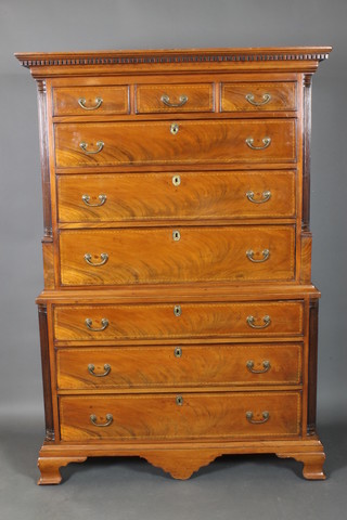 A George III inlaid mahogany chest on chest, the upper section with moulded and dentil cornice and having reeded columns to the side, fitted 3 short and 3 long drawers, the base with fluted columns to the side, fitted 3 long drawers, raised on ogee bracket feet 71"h x 48"w x 22"d 