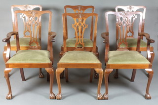 A set of 6 Chippendale style mahogany dining chairs with vase shaped slat backs and upholstered drop in seats, raised on cabriole supports comprising 2 carvers and 4 standard