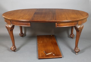 An Edwardian Chippendale style oval extending dining table with 2 extra leaves  29"h x 53"l x 88 1/2"l when extended, x 42"w 