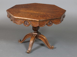 A Victorian carved oak octagonal occasional table, raised on a square pillar and tripod support 19"h x 27"w x 27"d