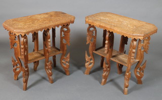 A pair of Indian carved hardwood 2 tier occasional tables, raised on 6 shaped and pierced supports 25"h x 26"w x 13 1/2"d