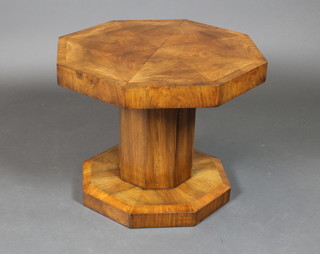 An Art Deco figured walnut octagonal occasional table, raised on a chamfered column with octagonal base 18"h x 23"w x 23"d 