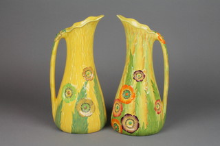 A pair of Carlton Ware Australian design yellow ground jugs decorated with spring flowers (1f) 14" 