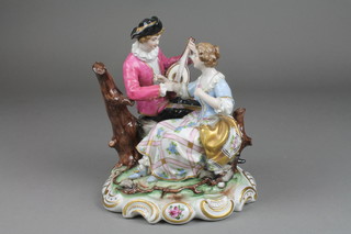 A 20th Century German porcelain group of a fete gallant group on a raised Rococo base 10" (f)