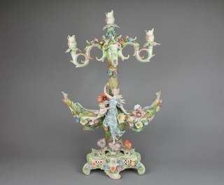 A 19th Century German porcelain centre piece candelabrum decorated with encrusted flowers and figures on a raised Rococo base, 25" (f)