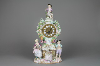 A 19th Century German porcelain Rococo clock surmounted by a seated child, the case with encrusted flowers and 3 figures to the raised Rococo base, 17" (f)