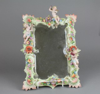 A 19th Century German porcelain rectangular easel mirror decorated with cherubs amongst flowers with bevelled plate 19" (f)