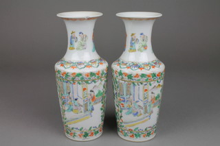 A pair of 19th Century famille verte tapered vases with waisted necks and panels of figures at pursuits in pavillion settings with birds amongst flowers 9 1/2" 9f)