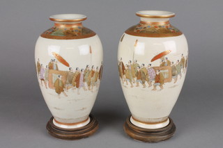 A pair of 19th Century Satsuma oviform vases decorated with a procession of figures with seal mark to base 7" 