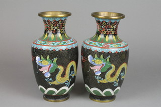 A pair of oviform cloisonne vases the black ground with dragons chasing a flaming pearl, 10"