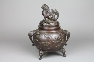 A 19th Century Japanese bronze Koro and cover with shi shi finial, the body decorated with birds amongst trees, on dragon feet 12" 