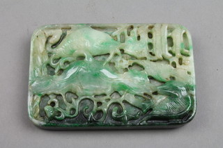 A rounded rectangular jade carving of fish amongst seaweed, 2 1/2" x 1 1/4" (f)
