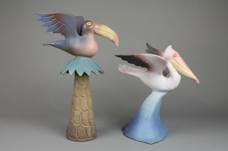 Tessa Fuchs, a polychrome glazed figure of a heron 12", a ditto of an exotic bird sitting on a palm tree 14" 