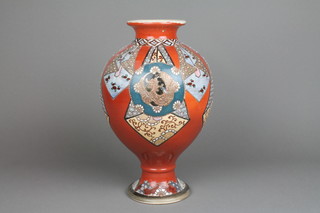An early 20th Century Japanese baluster vase with waisted foot and panels of geometric motifs and flowers 12"